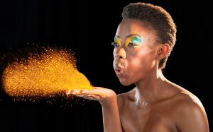 Girl Blowing Glitter